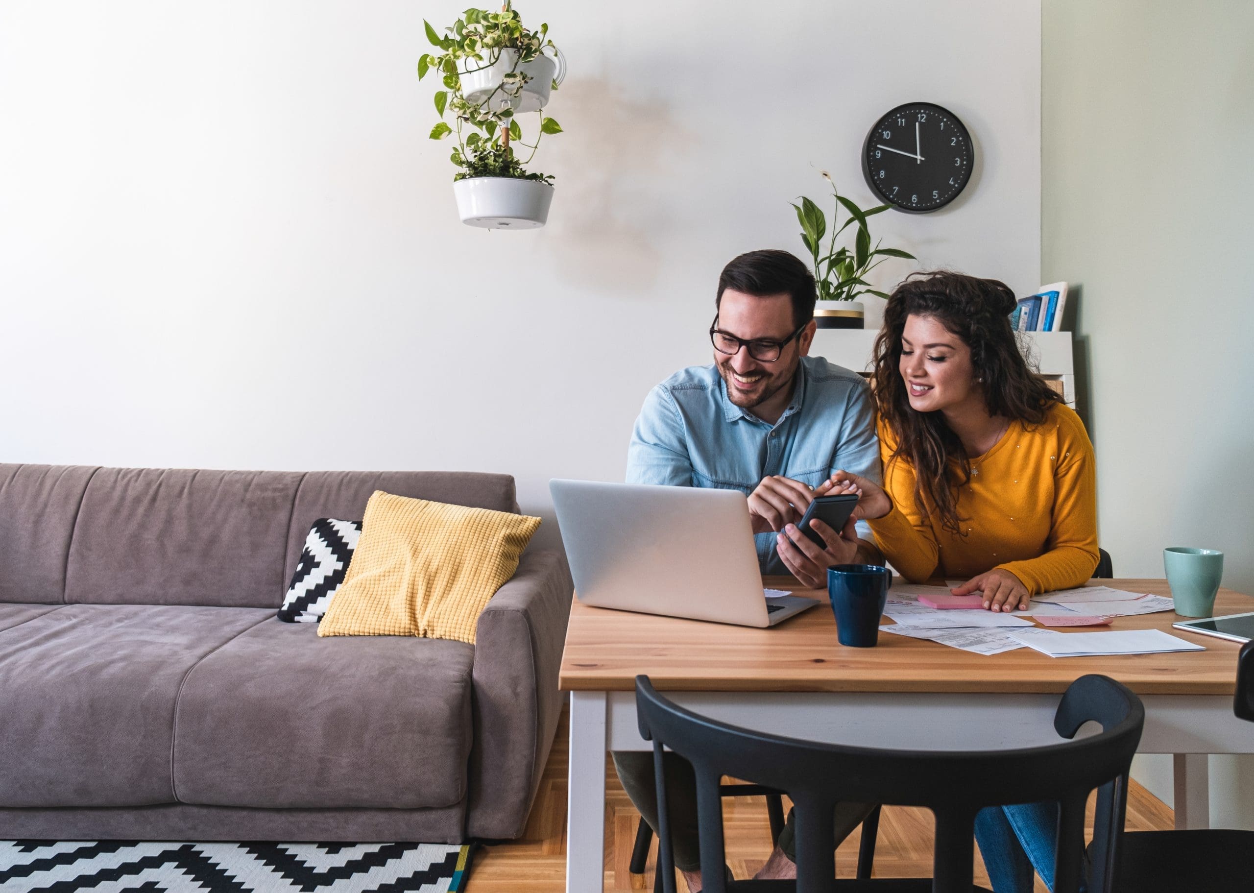 Smiling,Husband,And,Wife,Paying,Bills,Online